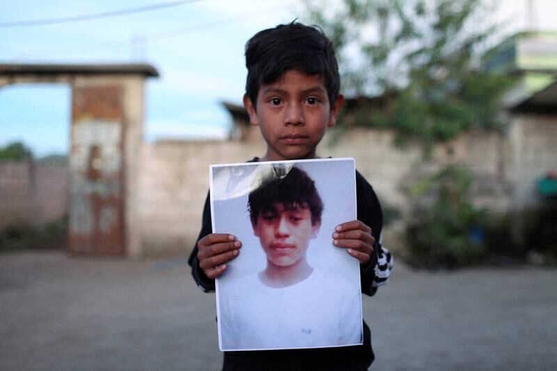 Alfonso holds a picture in Nahuala, Guatemala, of Pascual Melvin Guachiac, 13, who died in the trailer of a lorry along with other migrants in San Antonio, Texas. Reuters