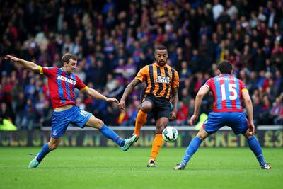 Tom Huddlestone of Hull City battles for the ball with James McArthur, left, and Mile Jedinak of Crystal Palace during their Premier League match on Saturday in Hull. Jan Kruger / Getty Images