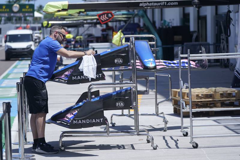 An Alpine crew member works on a nose and wing assembly as teams prepare for Sunday's Formula One Miami Grand Prix.