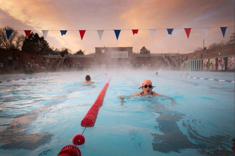 Early morning swimmers enjoy the water during sunrise at the Charlton Lido in Hornfair Park in London on its first day of reopening after the second national lockdown ended. AP Photo