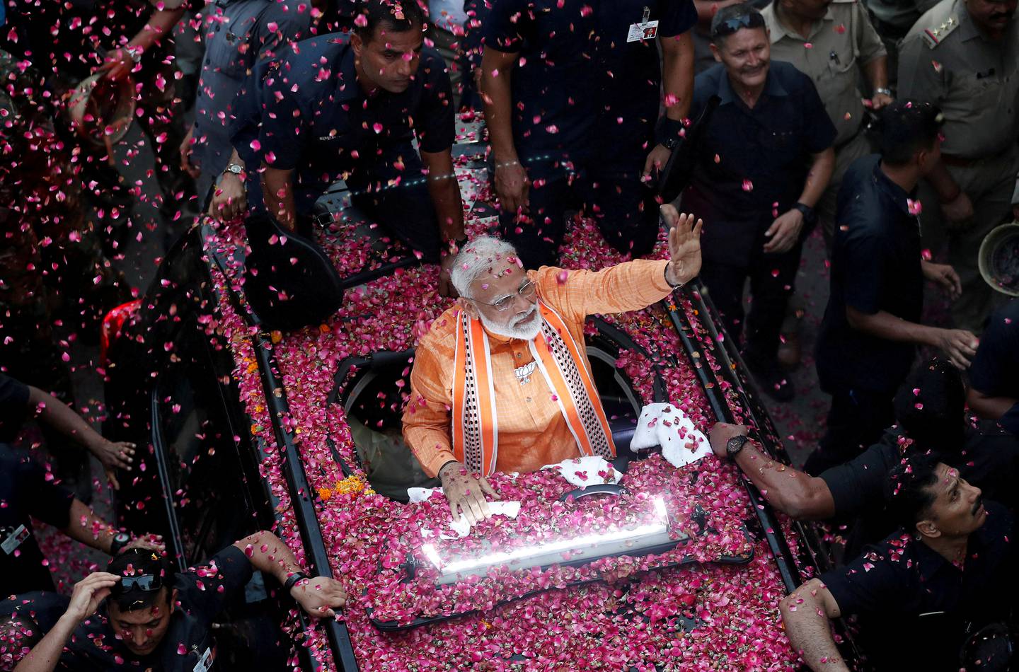 FILE PHOTO: India's Prime Minister Narendra Modi waves towards his supporters during a roadshow in Varanasi, India, April 25, 2019. REUTERS/Adnan Abidi/File Photo