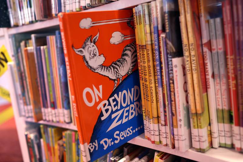 CHICAGO, ILLINOIS - MARCH 02: Books by Theodor Seuss Geisel, aka Dr. Seuss, including "On Beyond Zebra!" and "And to Think That I Saw it on Mulberry Street," are offered for loan at the Chinatown Branch of the Chicago Public Library on March 02, 2021 in Chicago, Illinois. The two titles are among six by the famed children's book author that will no longer be printed due to accusations of racist and insensitive imagery. The other titles include “If I Ran the Zoo,” “McElligot’s Pool,” “Scrambled Eggs Super!" and “The Cat’s Quizzer.” (Photo Illustration by Scott Olson/Getty Images)
== FOR NEWSPAPERS, INTERNET, TELCOS & TELEVISION USE ONLY ==
