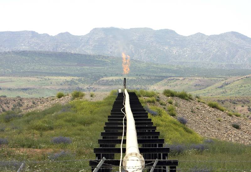 A flame rises from a pipeline at Tawke oil field. A surprise ruling by Iraq's Supreme Court has cast doubt on the legal foundations of the independent oil policy of Iraq's Kurdish-run region. Reuters