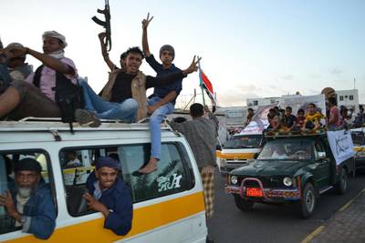 Yemenis celebrate in the Khormaskar area of Aden on December 17, 2015, after the rebels released hundreds of pro-government detainees as part of a prisoner swap.   Mohammed Al Qalisi for The National