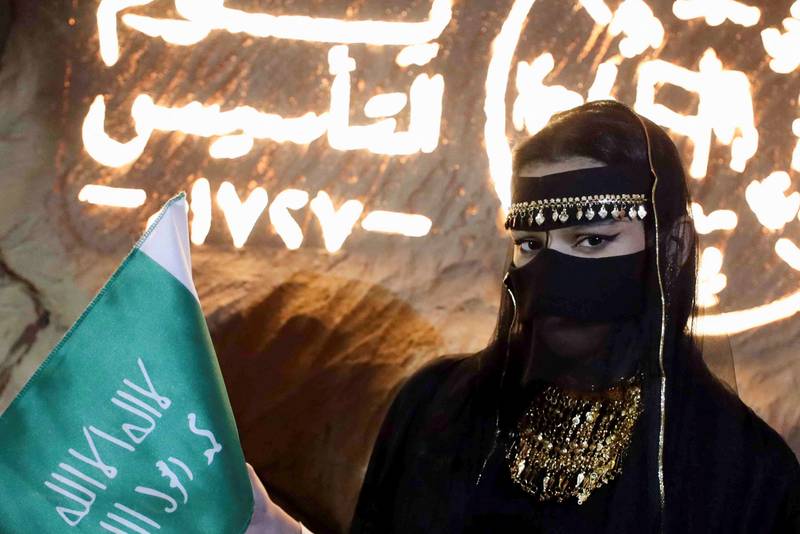 A Saudi woman poses as as she commemorates Founding Day in Riyadh.