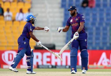 Deccan Gladiators' Kieron Pollard, right, and with Bhanuka Rajapaksa led their team to victory over Karnataka Tuskers in Abu Dhabi T10 at the Zayed Cricket Stadium. Chris Whiteoak / The National