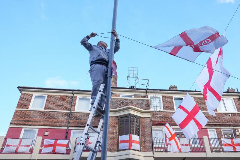England fans prepare at the Kirby estate in London. Reuters