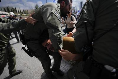 Israelis scuffles with police outside the parliament in Jerusalem. AP