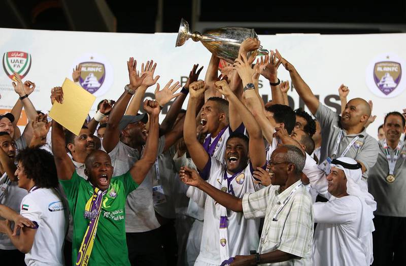 Al Ain players celebrate winning the President's Cup final. Pawan Singh / The National / May 18, 2014