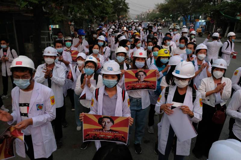 Medical staff and students take part in an early morning protest against the military coup and crackdown by security forces on demonstrations in Mandalay. AFP