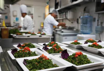 Abu Dhabi, U.A.E., May 21, 2018. InterContinental Abu Dhabi.  BYBLOS Arabic Restaurant meal preparations by chef and staff for Iftar.  Assistant chefs making final preparations at the kitchen before Iftar is served. Victor Besa / The NationalSection:  WeekendReporter:  Saeed Saeed