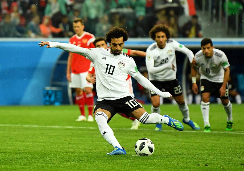 Egypt's Mohamed Salah scores their first goal from the penalty spot. Dylan Martinez / Reuters
