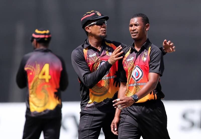 Papua New Guinea Charles Amini with Alei Nao, right, during their Cricket World Cup League 2 match against Nepal at the Dubai International Stadium. All images Chris Whiteoak / The National