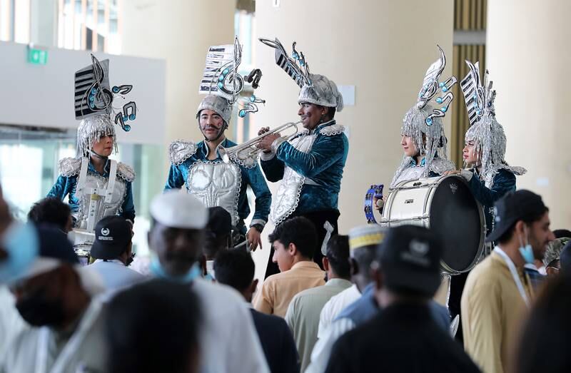Performers entertain the crowd at Meydan Racecourse. Pawan Singh / The National