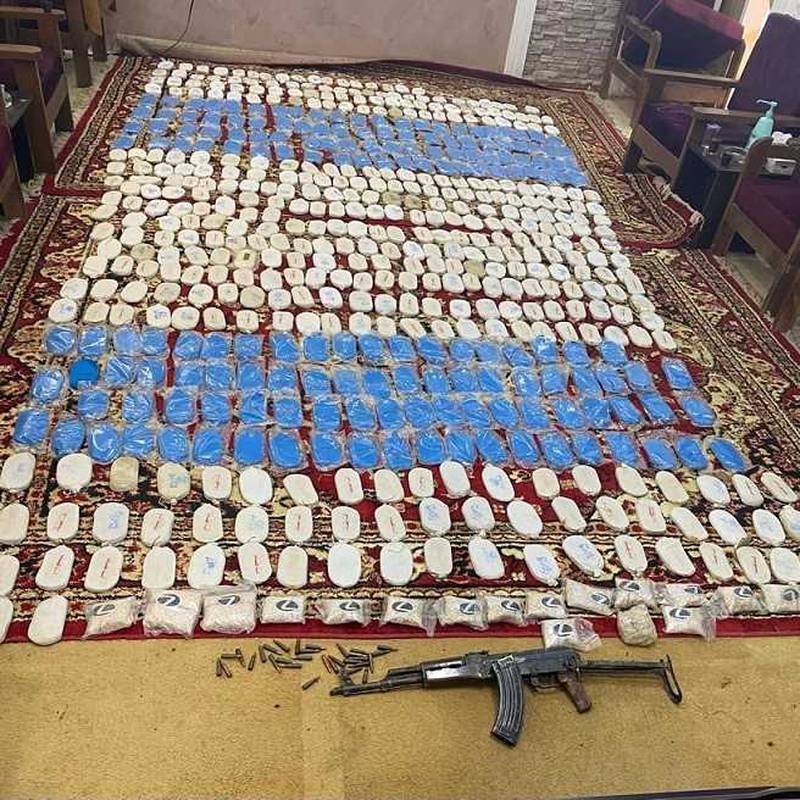Drugs, an AK-47 and ammunition were seized by the Jordanian military at the border with Syria. Photo: Jordanian News Agency