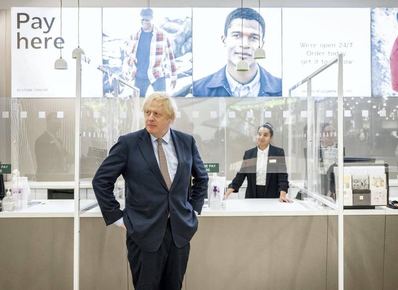 LONDON, ENGLAND - JUNE 14: British Prime Minister Boris Johnson visits M&S clothing department and other retail outlets in Westfield Stratford on June 14, 2020 in London, England. From Monday 15th June non essential shops such as clothes shop will be allowed to open to the public as long as they take Covid-19 safety steps. (Photo by John Nguyen - WPA Pool/Getty Images)