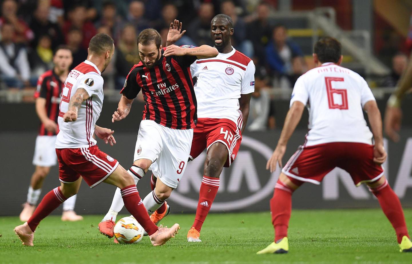 Soccer Football - Europa League - Group Stage - Group F - AC Milan v Olympiacos - San Siro, Milan, Italy - October 4, 2018  AC Milan's Gonzalo Higuain in action with Olympiacos' Yaya Toure    REUTERS/Daniele Mascolo