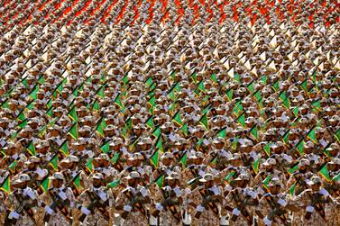 In this Sept. 22, 2014 file photo, members of the Iran's Revolutionary Guard march during an annual military parade at the mausoleum of Ayatollah Khomeini, outside Tehran, Iran. AP