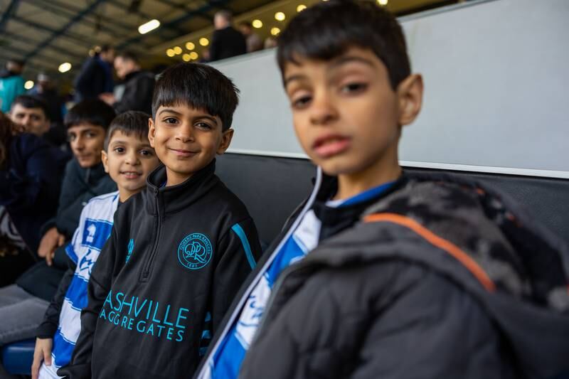 From right to left, Ilyas and Haris were joined by their cousins Idris and Ibrahim at the QPR open iftar event in west London. Mark Chilvers / The National