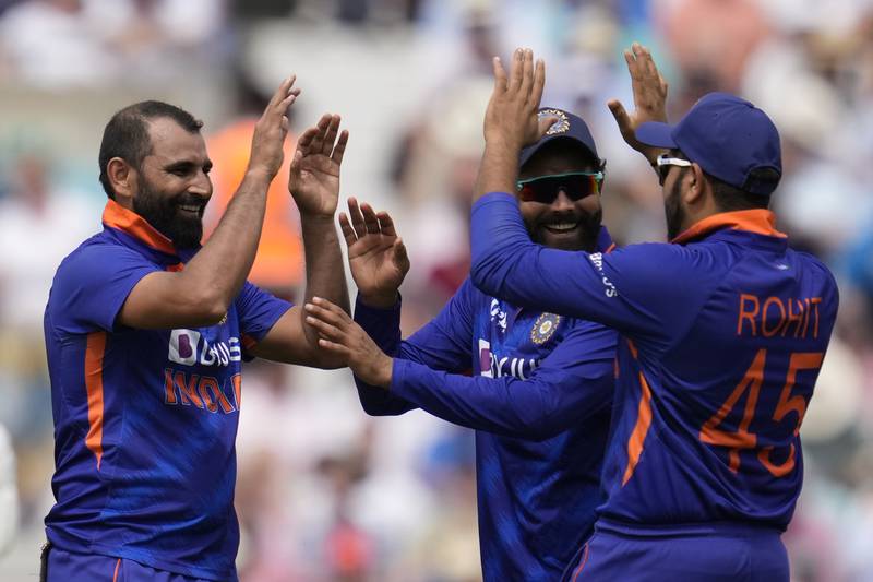 India bowler Mohammed Shami, left, celebrates the dismissal of England's Craig Overton for eight. AP