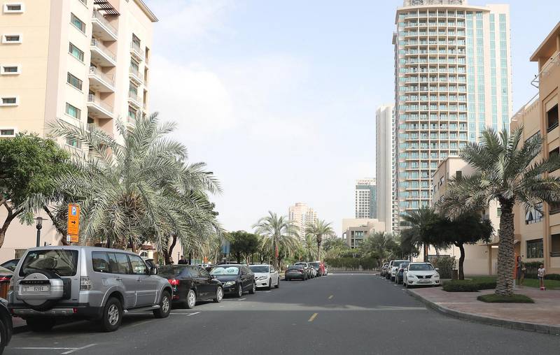 DUBAI, UNITED ARAB EMIRATES , March 22 – 2020 :- View of the quiet street in the Greens in Dubai. Most of the residents staying at home as a preventive measure against coronavirus. (Pawan Singh / The National) For News/Online/Instagram. 