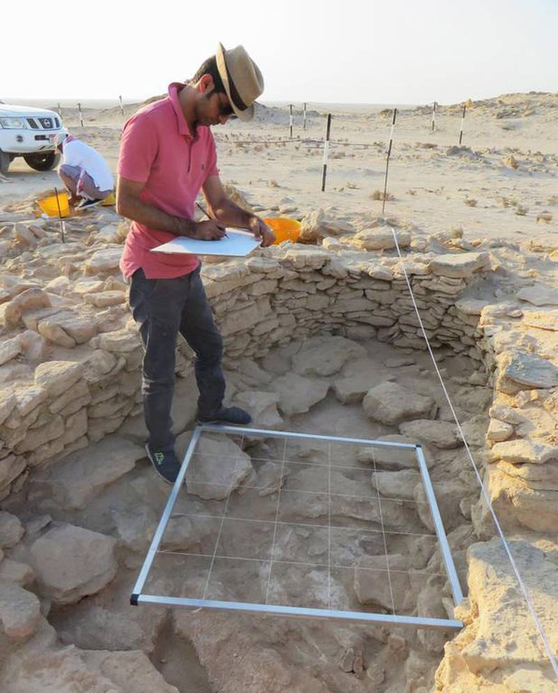 Abu Dhabi Tourism and Culture Authority archaeologist Abdulla Al Kaabi recording detail of the 7,000-year-old house on the island of Marawah, which reveals much about the lives and habits of Abu Dhabi’s earliest inhabitants.  Photo courtesy Abu Dhabi Tourism & Culture Authority