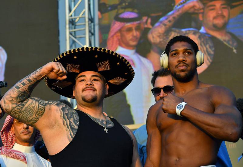 Andy Ruiz Jr (L) and Anthony Joshua pose during the official weigh-in. AFP