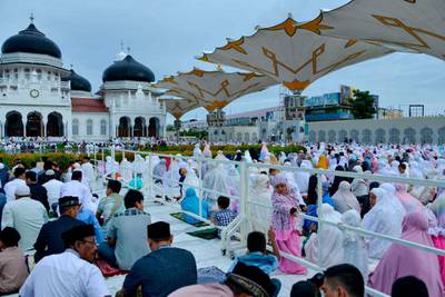 Indonesians attend a morning prayer celebrating the Eid Al Adha festival at the Baiturrahman mosque in Banda Aceh.  EPA
