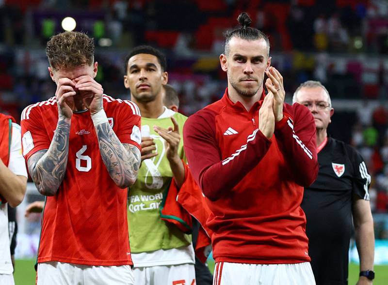 Wales' Gareth Bale and Joe Rodon look dejected after the match as Wales are eliminated from the World Cup. Reuters
