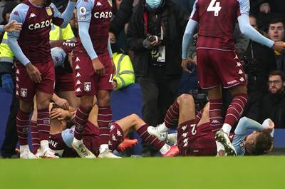Aston Villa's Lucas Digne and Matty Cash after being hit by a projectile after Emiliano Buendia scored their side's first goal against Everton at Goodison Park on Saturday, January 22, 2022. PA