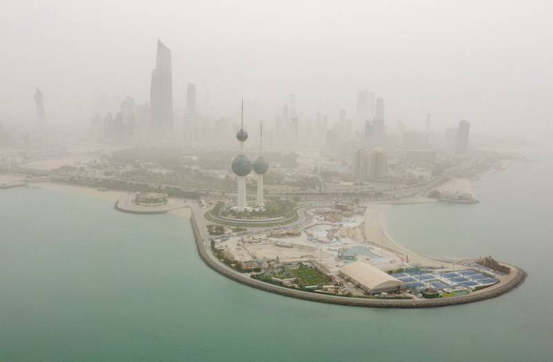 An aerial view shows Kuwait City during a dust storm. AFP