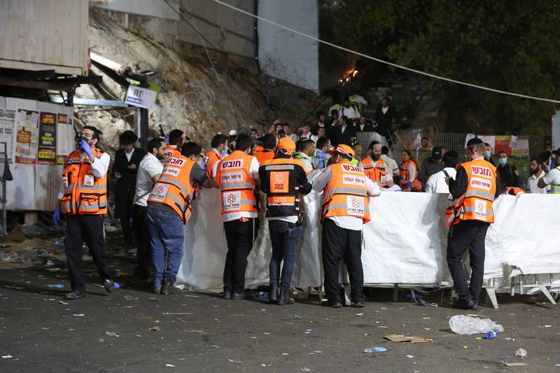 Emergency workers gather at the scene after dozens of people were killed and others injured at the Lag BaOmer festival  at Mount Meron, Israel. AFP