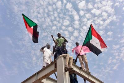 Sudanese protesters from the city of Atbara arrive at the Bahari station in Khartoum, to celebrate transition to civilian rule.  AFP