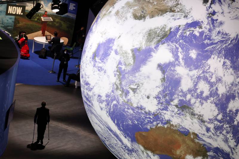 A person walks through the venue of the Cop26 summit in Glasgow, Scotland. Reuters