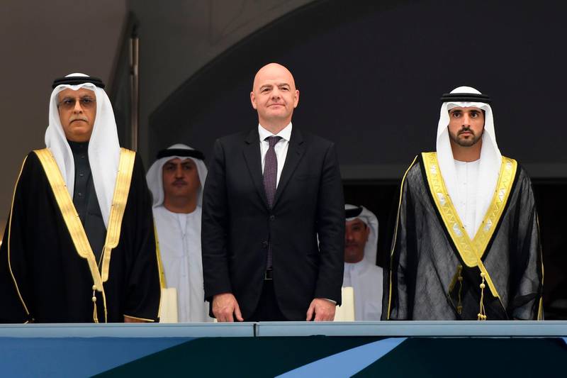 Sheikh Hamdan bin Mohammed bin Rashid Al Maktoum, Crown Prince of Dubai, right; FIFA President Gianni Infantino, center; and UAE officials attend the opening ceremony of 2019 AFC Asian Cup. AFP