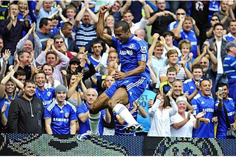 Ashley Cole celebrates scoring Chelsea's third against Burnley at Stamford Bridge.