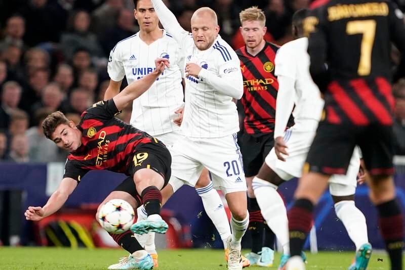 Manchester City's Julian Alvarez, left, and FC Copenhagen's Nicolai Boilesen, centre, vie for the ball. AP