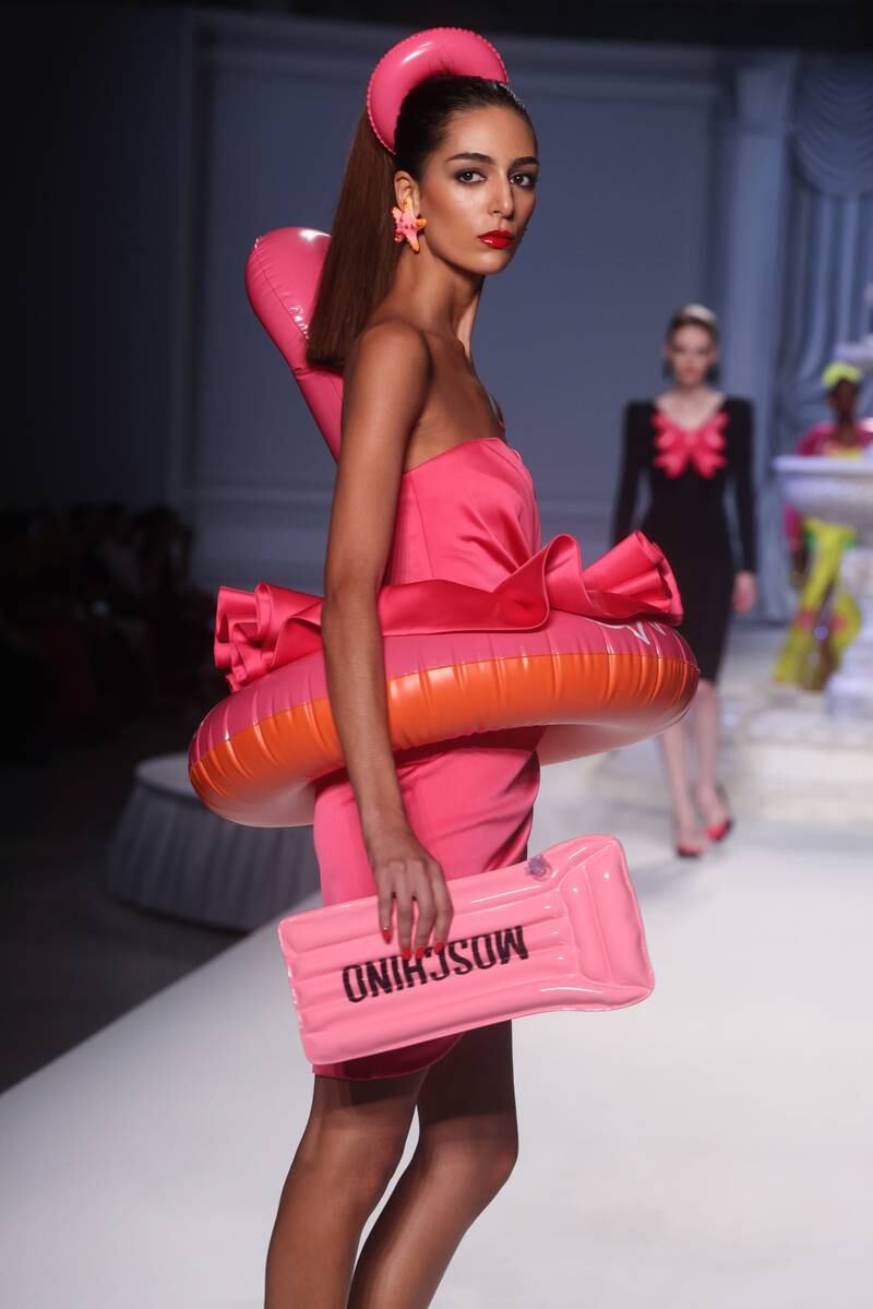 Model Nora Attal wears a dress with a rubber ring for Moschino. EPA 
