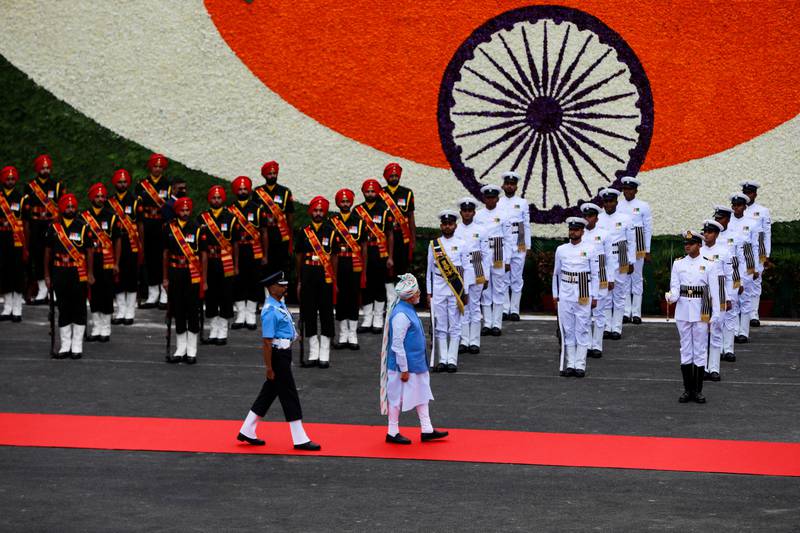 Mr Modi inspects the honour guard during the Independence Day celebrations at the fort. Reuters