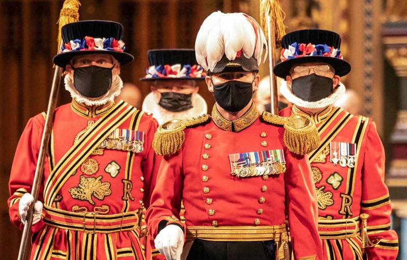 Masked Yeoman warders march along the Royal gallery to take part in the traditional "Ceremonial Search" during the State Opening of Parliament at the Houses of Parliament in London. AFP