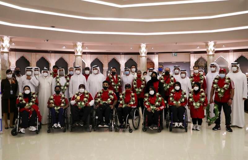 The UAE Paralympic team are welcomed by officials at Abu Dhabi International Airport.