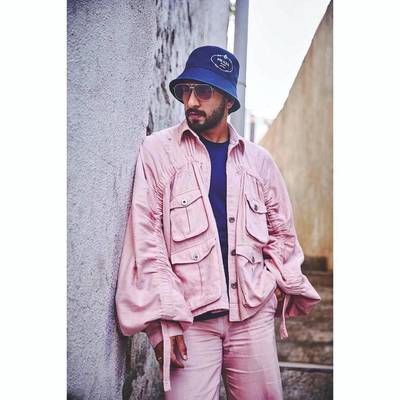 Louche silhouettes lent this pink two-piece a more relaxed feel, along with the navy bucket hat. Instagram / Ranveer Singh
