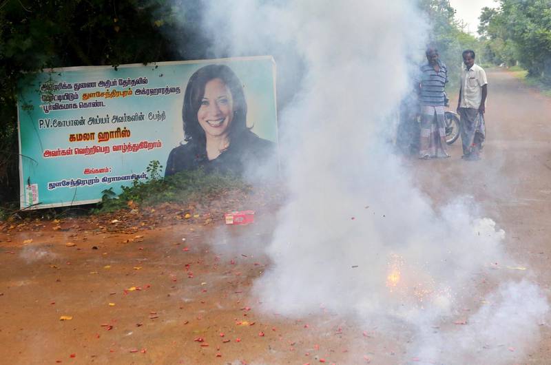 Villagers burst firecrackers to celebrate the victory of U.S. Vice President-elect Kamala Harris in Thulasendrapuram, the hometown of Harris' maternal grandfather, south of Chennai, Tamil Nadu state, India, Sunday, Nov. 8, 2020. Waking up to the news of Kamala Harris' election as Joe Biden's running mate, overjoyed people in her small ancestral Indian village set off firecrackers, carried her placards and offered prayers. (AP Photo/Aijaz Rahi)
