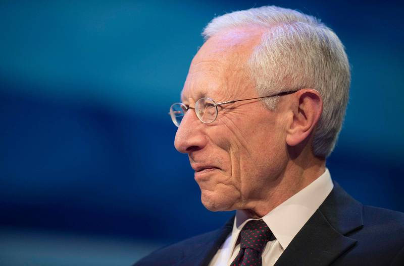 (FILES) This file photo taken on October 09, 2014 shows Federal Reserve Vice Chair Stanley Fischer speaking during a CNN Debate on the Global Economy in Washington, DC, ahead of the International Monetary Fund (IMF)/World Bank meetings.  
Stanley Fischer, the vice chairman of the Federal Reserve, announced September 6, 2017 he will retire next month, creating a third vacancy for President Donald Trump to fill at the US central bank. The 73-year-old will step down on October 13, nearly a year before his term as vice chair was due to expire and two and a half years before the end of his term on the Fed's board of governors, the Fed said in a statement.
 / AFP PHOTO / Jim WATSON