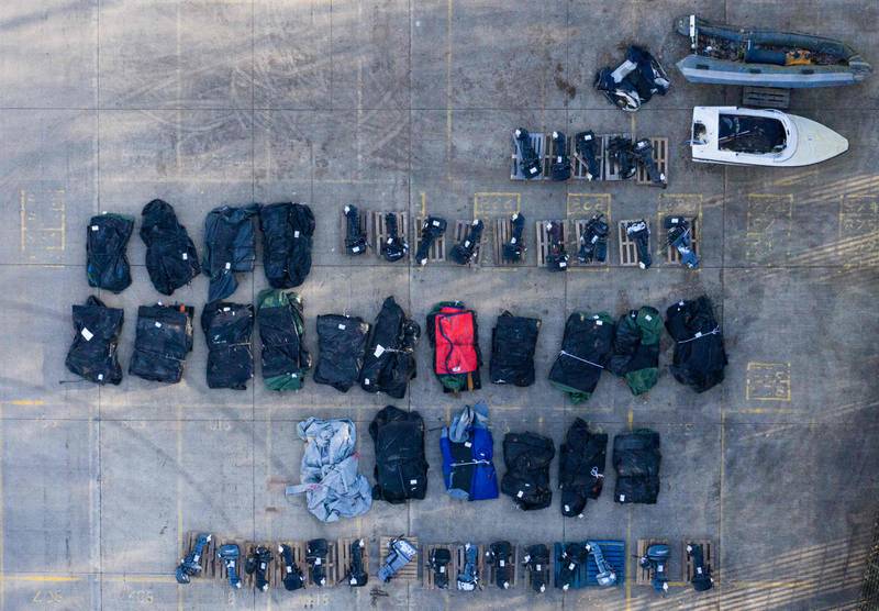 Inflatable dinghies and outboard engines, stored in a Port Authority yard in Dover. AFP