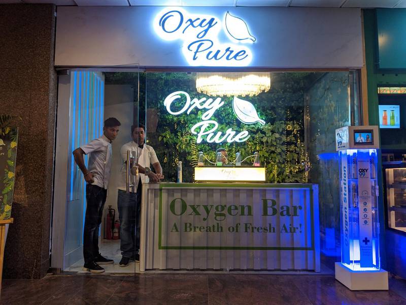 A customer inhaling clean air using a cannula strapped at their nostrils at Oxy Pure, an oxygen bar at Select Citywalk mall in New Delhi on Saturday. Taniya Dutta for The National