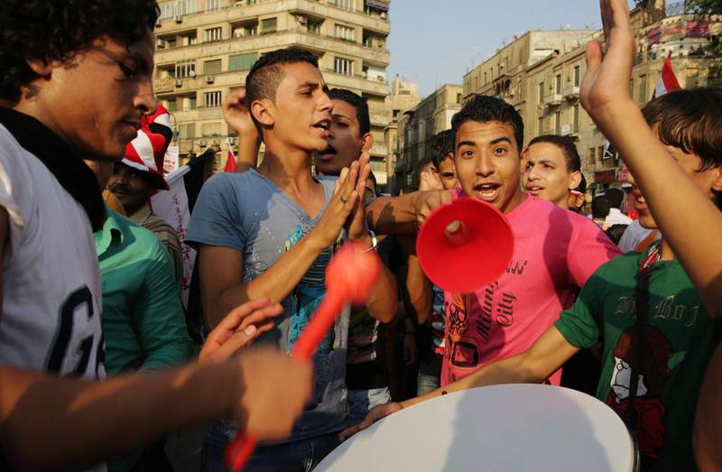 Supporters of Egyptian president Abdel Fattah El Sisi celebrate his inauguration while holding a rally in Tahrir Square in Cairo on June 8, 2014. At least nine women were sexually assaulted by mobs in Tahrir Square between June 3 and 8, during celebrations of Mr El Sisi’s electoral win and his inauguration. Thomas Hartwell / AP Photo