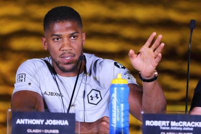 Anthony Joshua addresses the media during a press conference for "Clash on the Dunes". EPA