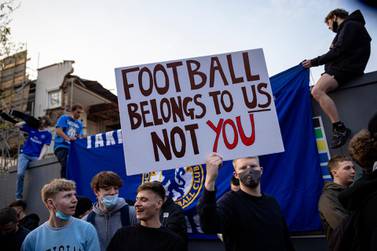 Chelsea fans celebrate outside Stamford Bridge after the club announced they were pulling out of the proposed European Super League. Getty