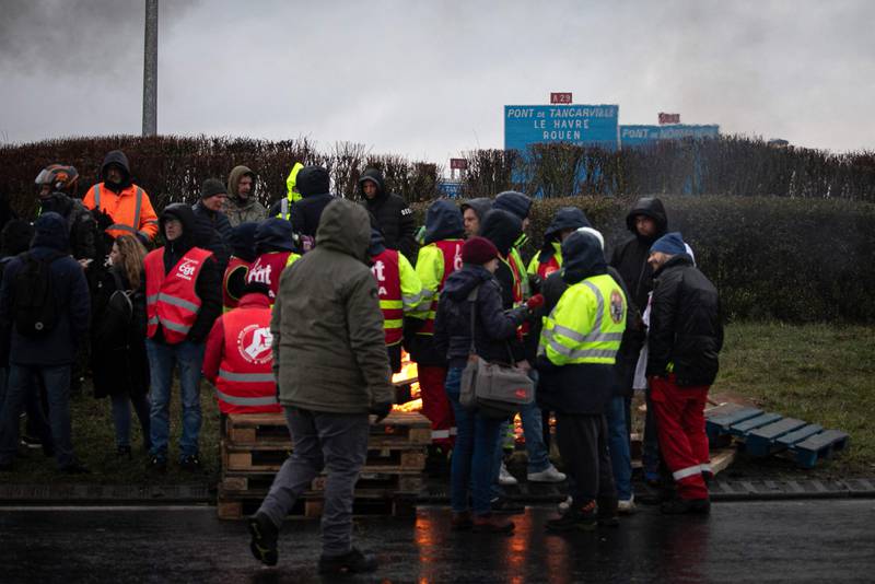 Unionists block a road near Le Havre, north-western France. AFP